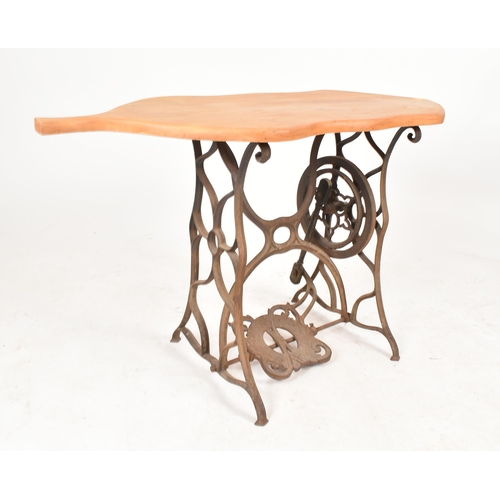 77 - A vintage 20th century converted cast iron sewing machine table / hall table. The table having an el... 