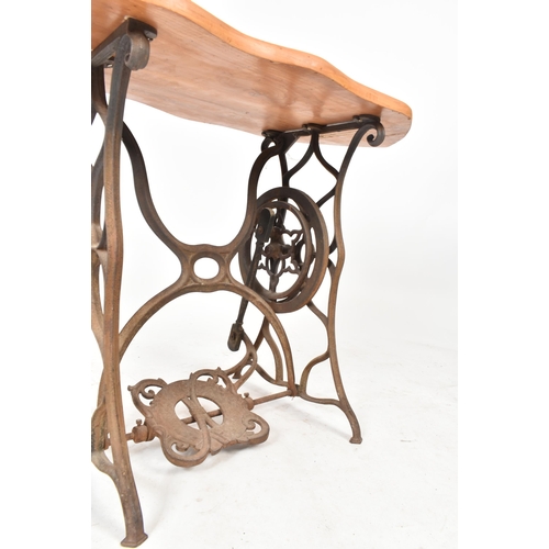 77 - A vintage 20th century converted cast iron sewing machine table / hall table. The table having an el... 