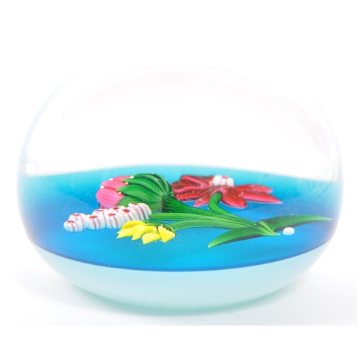 106 - Baccarat - A 20th century circa 1970s French Baccarat glass paperweight. The paperweight having blue... 