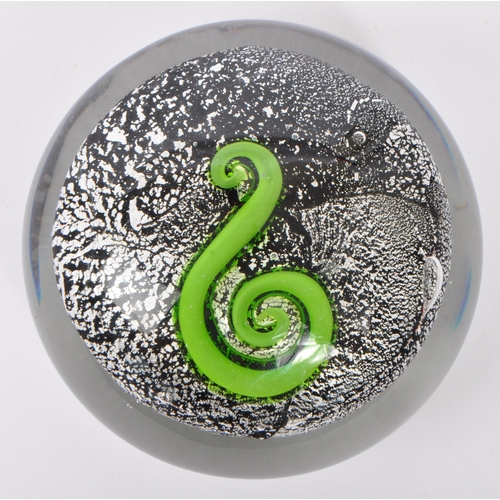 108 - A 20th century circa 1970s New Zealand art glass paperweight having silver azurine to surround of gr... 