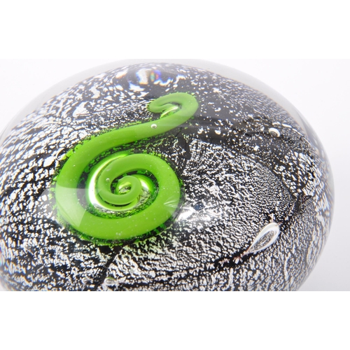 108 - A 20th century circa 1970s New Zealand art glass paperweight having silver azurine to surround of gr... 