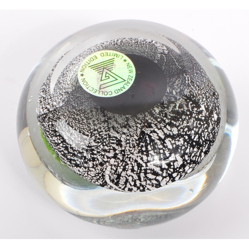 108 - A 20th century circa 1970s New Zealand art glass paperweight having silver azurine to surround of gr... 