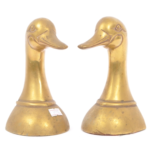 244 - A vintage 20th century brass bookends in the form of duck heads / busts. Measures approx. 16cm tall.