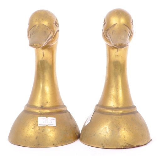 244 - A vintage 20th century brass bookends in the form of duck heads / busts. Measures approx. 16cm tall.
