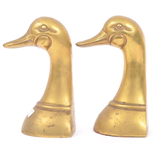 244 - A vintage 20th century brass bookends in the form of duck heads / busts. Measures approx. 16cm tall.