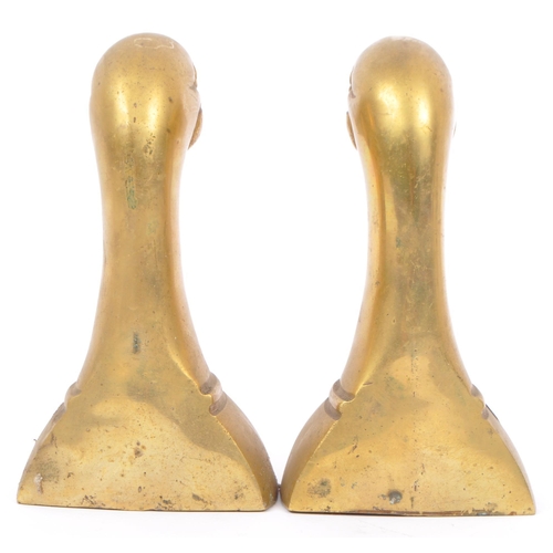 244 - A vintage 20th century brass bookends in the form of duck heads / busts. Measures approx. 16cm tall.