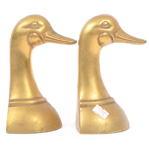 244 - A vintage 20th century brass bookends in the form of duck heads / busts. Measures approx. 16cm tall.