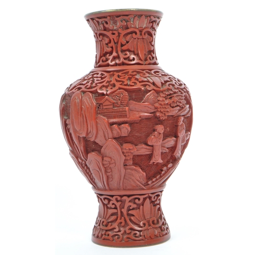 248 - A 19th century Chinese cinnabar enamelled baluster vase. The vase having bronze rim with interior of... 