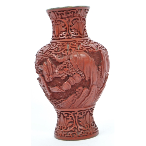 248 - A 19th century Chinese cinnabar enamelled baluster vase. The vase having bronze rim with interior of... 