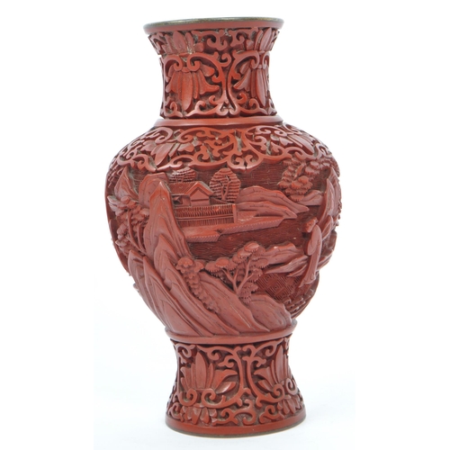 248 - A 19th century Chinese cinnabar enamelled baluster vase. The vase having bronze rim with interior of... 