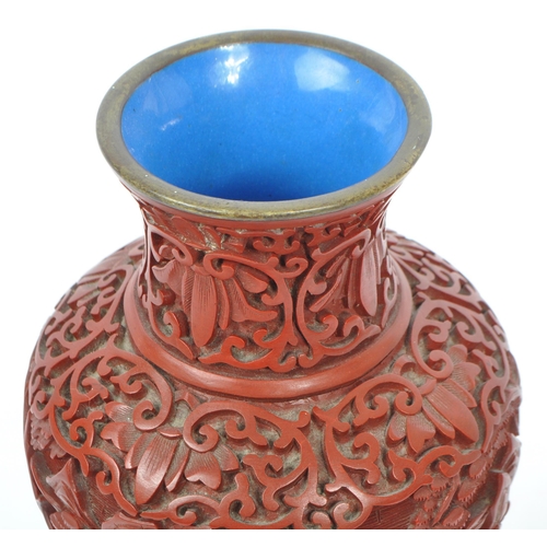 248 - A 19th century Chinese cinnabar enamelled baluster vase. The vase having bronze rim with interior of... 