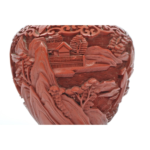 248 - A 19th century Chinese cinnabar enamelled baluster vase. The vase having bronze rim with interior of... 