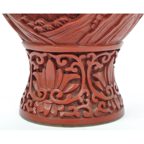 248 - A 19th century Chinese cinnabar enamelled baluster vase. The vase having bronze rim with interior of... 