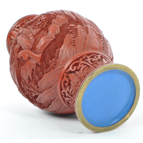 248 - A 19th century Chinese cinnabar enamelled baluster vase. The vase having bronze rim with interior of... 