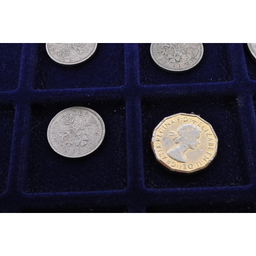 499 - A collection of mid 20th century uncirculated pre decimalisation UK coin currency. Most threepence p... 
