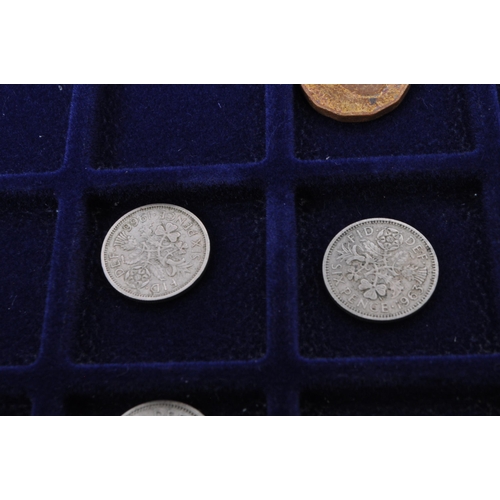 499 - A collection of mid 20th century uncirculated pre decimalisation UK coin currency. Most threepence p... 