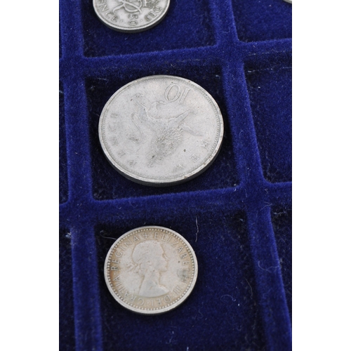 499 - A collection of mid 20th century uncirculated pre decimalisation UK coin currency. Most threepence p... 