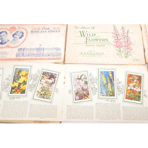 502 - A collection of vintage 20th century Wills's cigarette cards. Including, Our King and Queen, Wild Fl... 