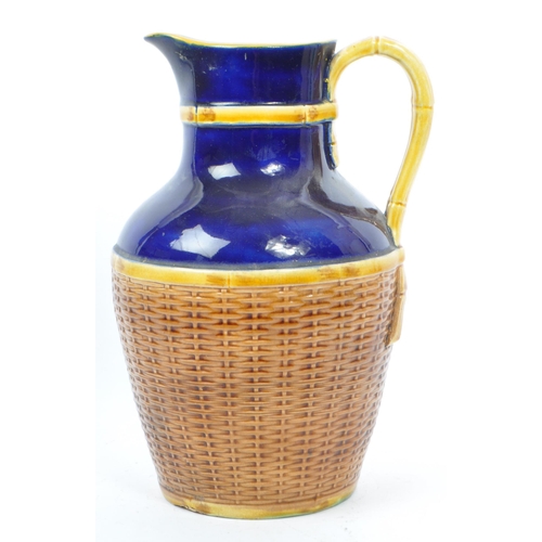 63 - George Jones - A 19th century George Jones majolica pottery 'Basket' jug. The basket having cobalt g... 