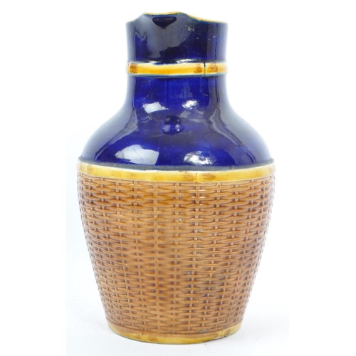 63 - George Jones - A 19th century George Jones majolica pottery 'Basket' jug. The basket having cobalt g... 