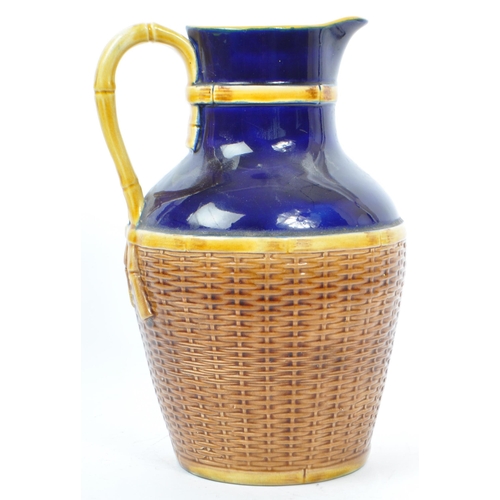 63 - George Jones - A 19th century George Jones majolica pottery 'Basket' jug. The basket having cobalt g... 