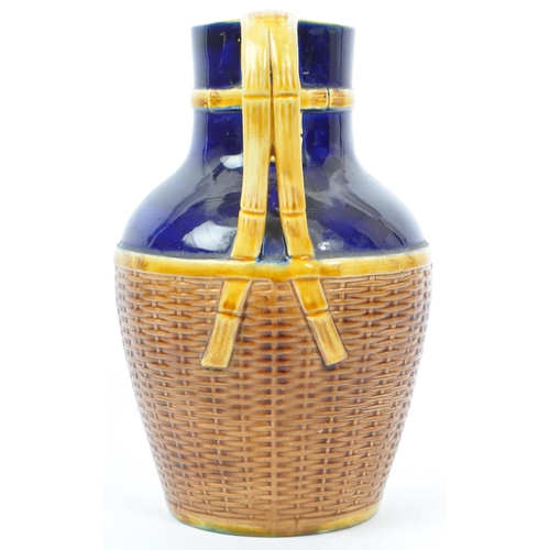 63 - George Jones - A 19th century George Jones majolica pottery 'Basket' jug. The basket having cobalt g... 