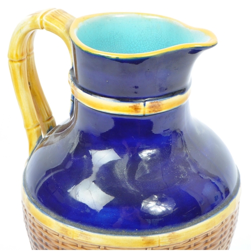 63 - George Jones - A 19th century George Jones majolica pottery 'Basket' jug. The basket having cobalt g... 
