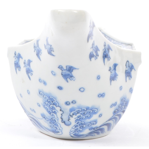 65 - An early 20th century Japanese Taisho period blue and white porcelain hand painted boat bowl of irre... 