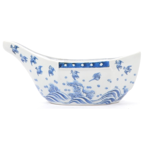 65 - An early 20th century Japanese Taisho period blue and white porcelain hand painted boat bowl of irre... 