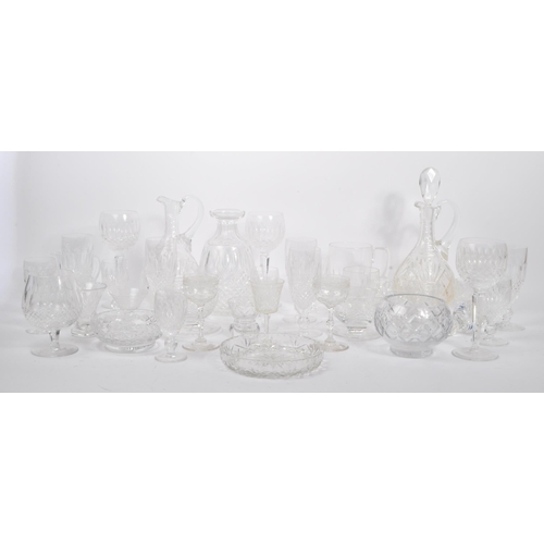 76 - A large collection of 19th century and later cut glass to include Waterford crystal. The lot to incl... 