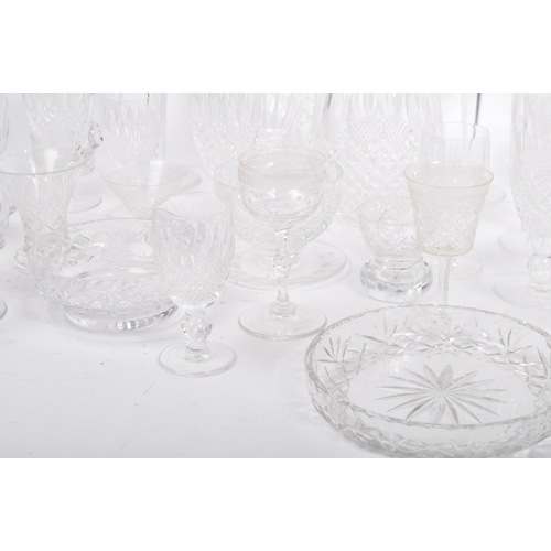 76 - A large collection of 19th century and later cut glass to include Waterford crystal. The lot to incl... 