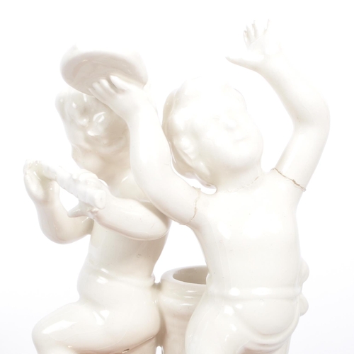 81 - A collection of 20th century Italian porcelain Bassano blanc de chine band figures and stem / spill ... 