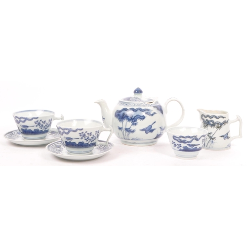 88 - An early 20th century Chinese porcelain two person tea service comprising of teacups, saucers and su... 