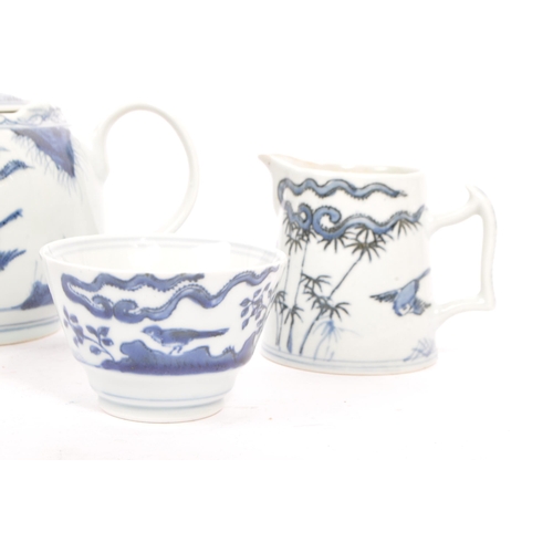 88 - An early 20th century Chinese porcelain two person tea service comprising of teacups, saucers and su... 