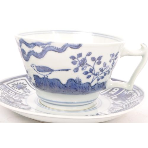 88 - An early 20th century Chinese porcelain two person tea service comprising of teacups, saucers and su... 