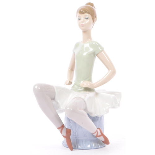 89 - Lladro - Nao - A collection of four late 20th century porcelain tableware figurines. To include a ba... 