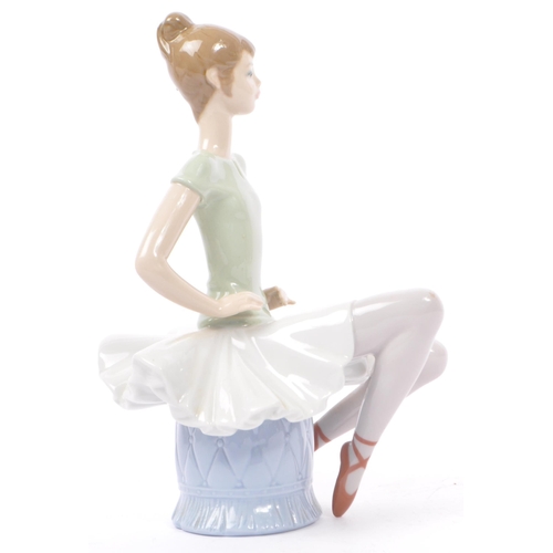 89 - Lladro - Nao - A collection of four late 20th century porcelain tableware figurines. To include a ba... 