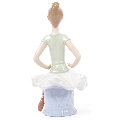 89 - Lladro - Nao - A collection of four late 20th century porcelain tableware figurines. To include a ba... 
