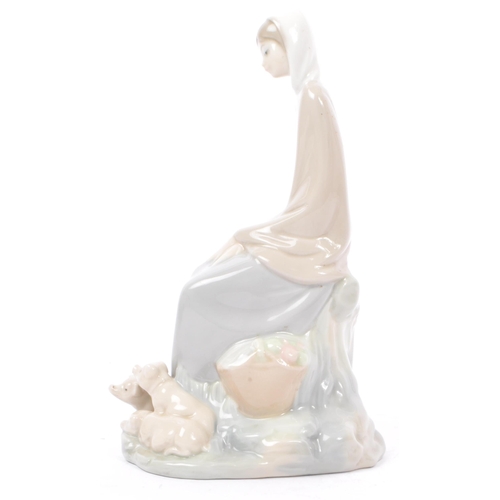 89 - Lladro - Nao - A collection of four late 20th century porcelain tableware figurines. To include a ba... 