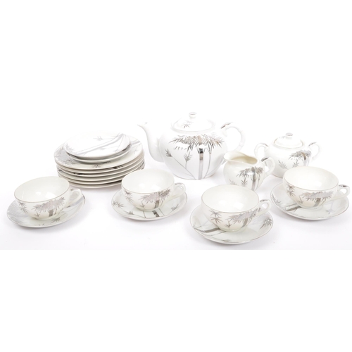 90 - A set of two vintage 20th century Asian Japanese tea services sets. Comprising of teapot, cups, sauc... 