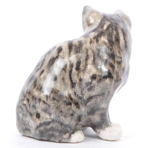 94 - A collection of vintage 20th century studio art pottery cats. In the form of tabby cats with two kit... 