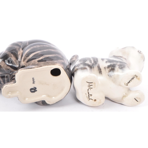 94 - A collection of vintage 20th century studio art pottery cats. In the form of tabby cats with two kit... 