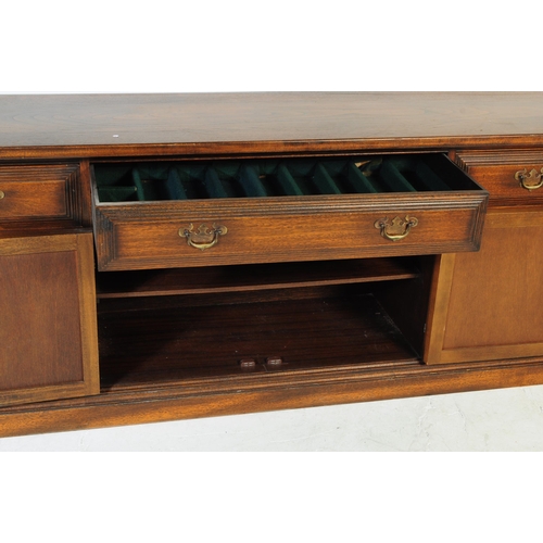 1055 - Younger - A mid century circa 1970s Younger Toledo oak sideboard credenza. The sideboard having cham... 