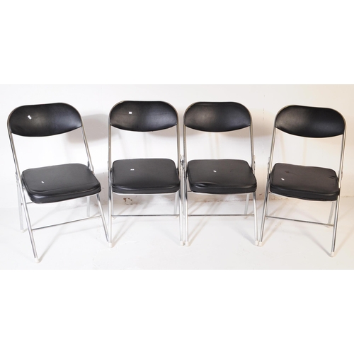 606 - A collection of four mid Century folding chairs constructed from a tubular chromed metal with black ... 