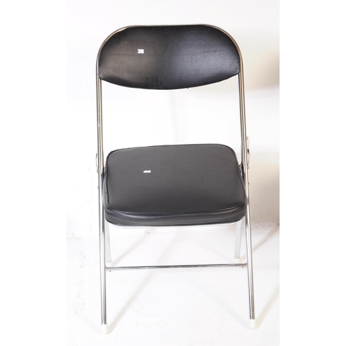 606 - A collection of four mid Century folding chairs constructed from a tubular chromed metal with black ... 