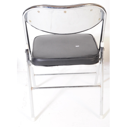 606 - A collection of four mid Century folding chairs constructed from a tubular chromed metal with black ... 