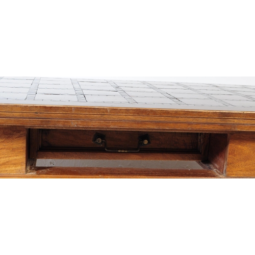 607 - A vintage 20th century solid pine and oak coffee table. Of rectangular form with mosaic style tiles ... 