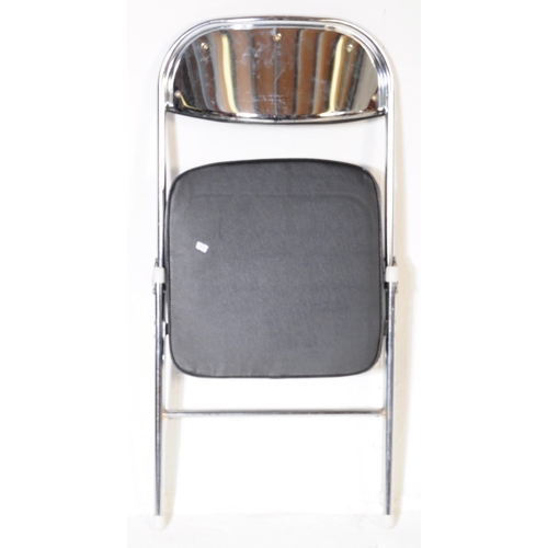 608 - A collection of five mid Century folding chairs constructed from a tubular chromed metal with black ... 