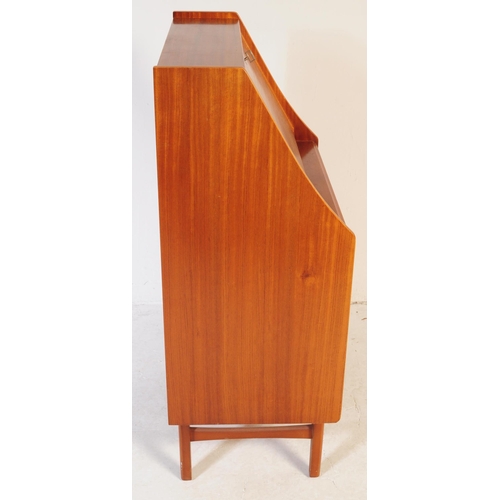 610 - British Modern Design - A mid 20th century teak bureau in the manner of Jentique furniture. The bure... 