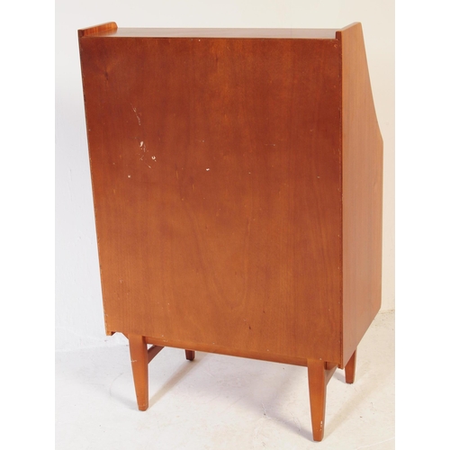 610 - British Modern Design - A mid 20th century teak bureau in the manner of Jentique furniture. The bure... 